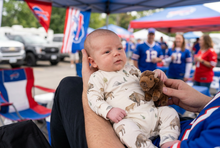 Load image into Gallery viewer, Baby in the bison romper at a Buffalo Bills tailgate
