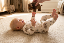 Load image into Gallery viewer, Blonde baby boy playing with a buffalo plush in a farmhouse