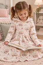 Load image into Gallery viewer, Girl with pigtails reading in a dress using the listing’s Hedgehog fabric reference