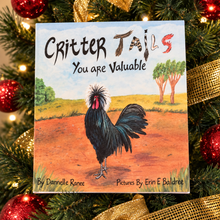 Load image into Gallery viewer, Critter Tails You Are Valuable chicken book displayed among red ornaments and gold ribbon in a Christmas tree