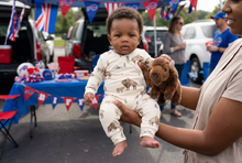 Load image into Gallery viewer, Baby boy held by a parent at a Bills tailgate
