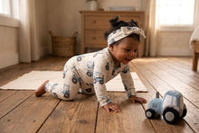 Load image into Gallery viewer, Baby girl with tiny pigtails crawling toward a tractor toy in a farmhouse room
