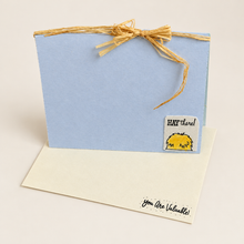 Load image into Gallery viewer, Blue handmade chicken greeting card with raffia bow and a cream You Are Valuable envelope

